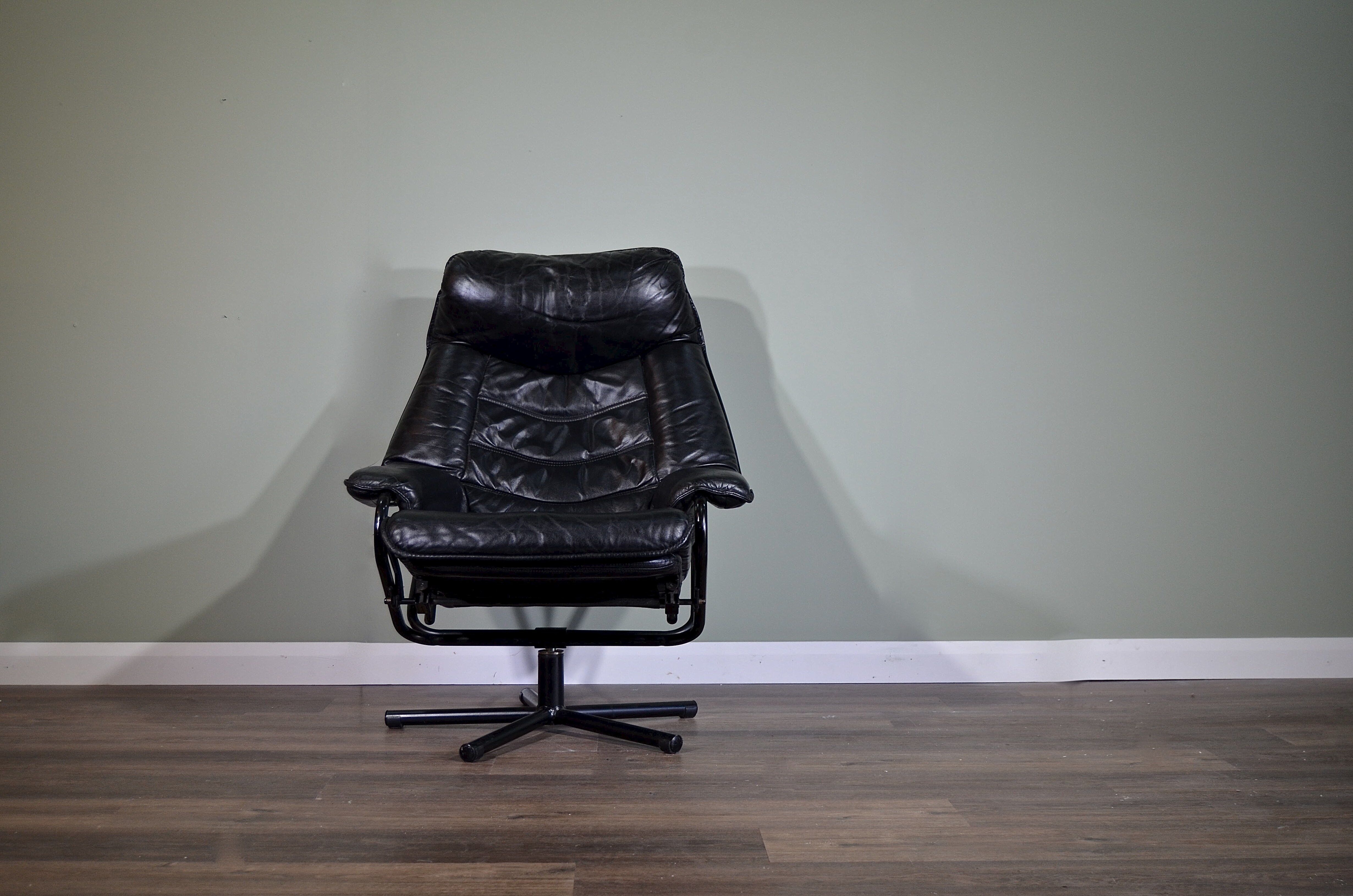 Norwegian Skoghaug industries vintage black leather swivel reclining chair