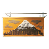 Beautiful wall-mounted Swedish fabric print with motifs of mountains, reindeer and more.