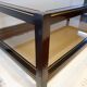 Table basse noire ,or et double plateau verre fumé