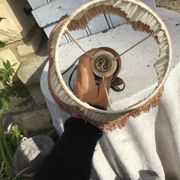 Turned wooden foot lamp with pleated lampshade