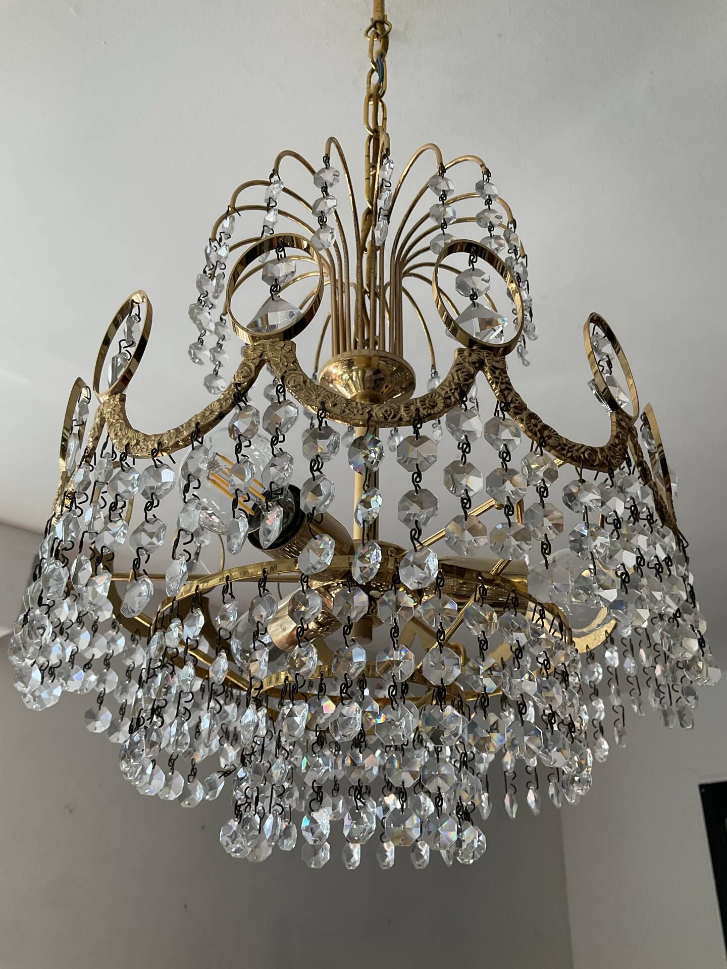 Brass chandelier with crystal pendants from the 1970s.
