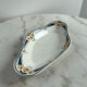 Longwy ramekin with blue and orange floral decoration.