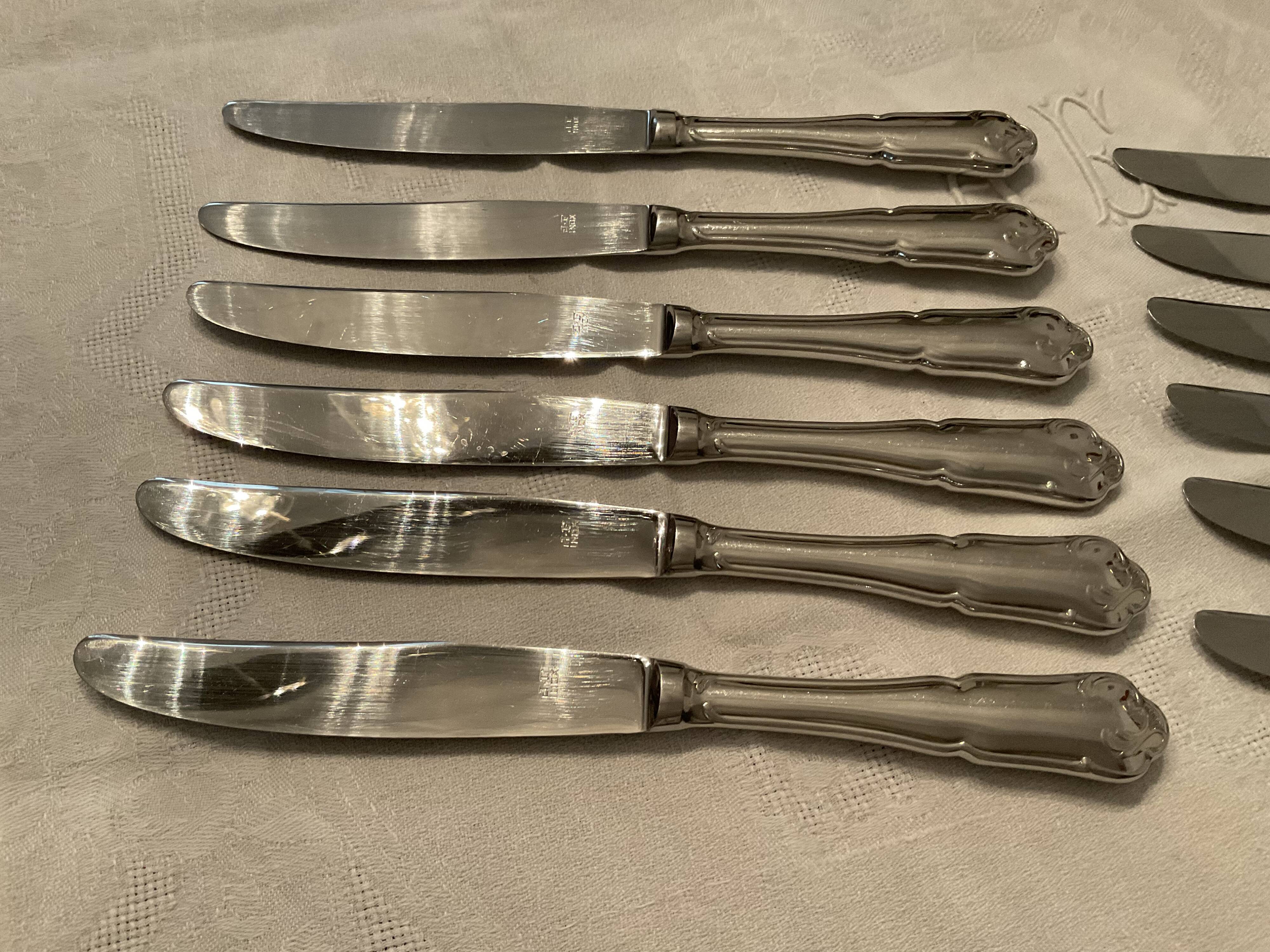 12 stainless steel knives. vintage