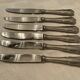 12 stainless steel knives. vintage