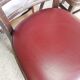 Set of 19 vintage wooden bistro chairs with red faux leather.