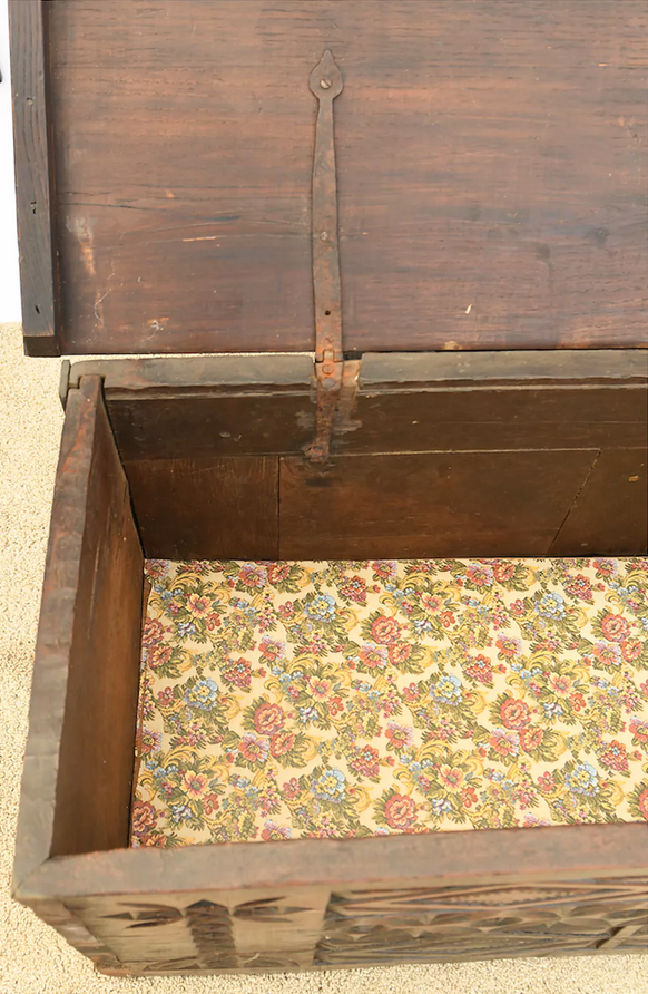 Antique chest in carved wood
