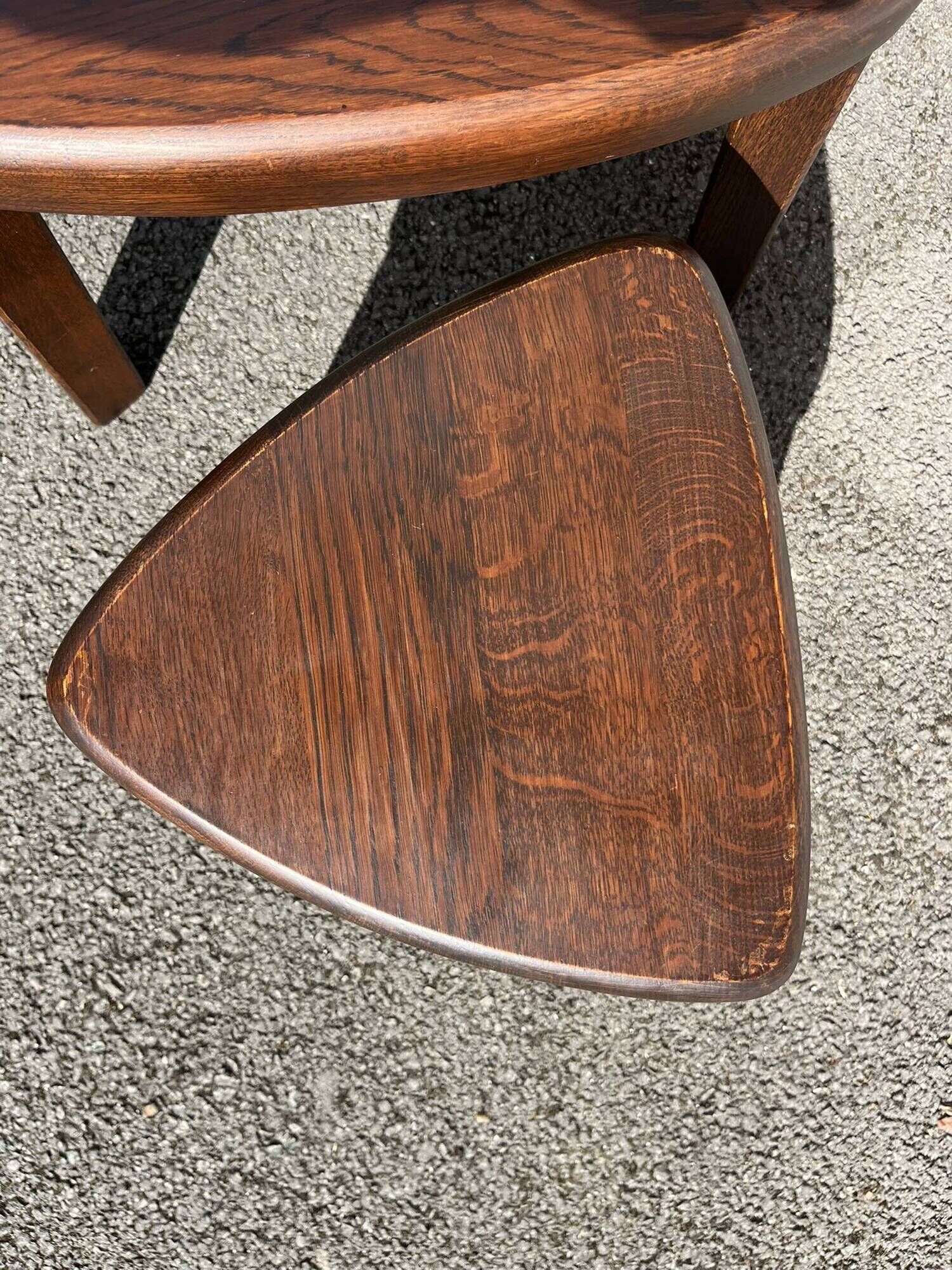 Nested tripod tables made of solid wood, in a modernist brutalist style.