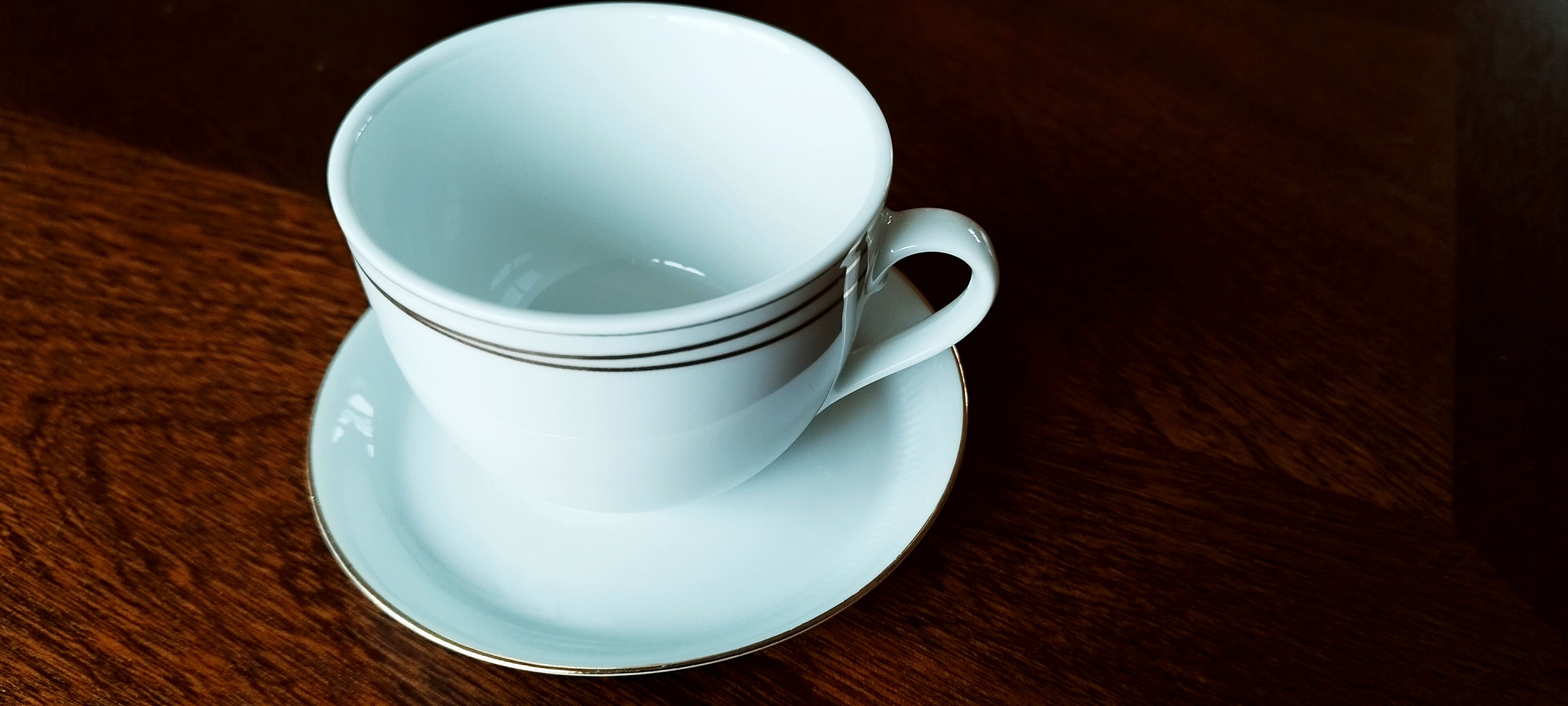 Set of 4 white and gold porcelain cups