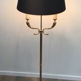 Floor lamp of parquet in neoclassical style in brass with dolphin heads. french work of the ma