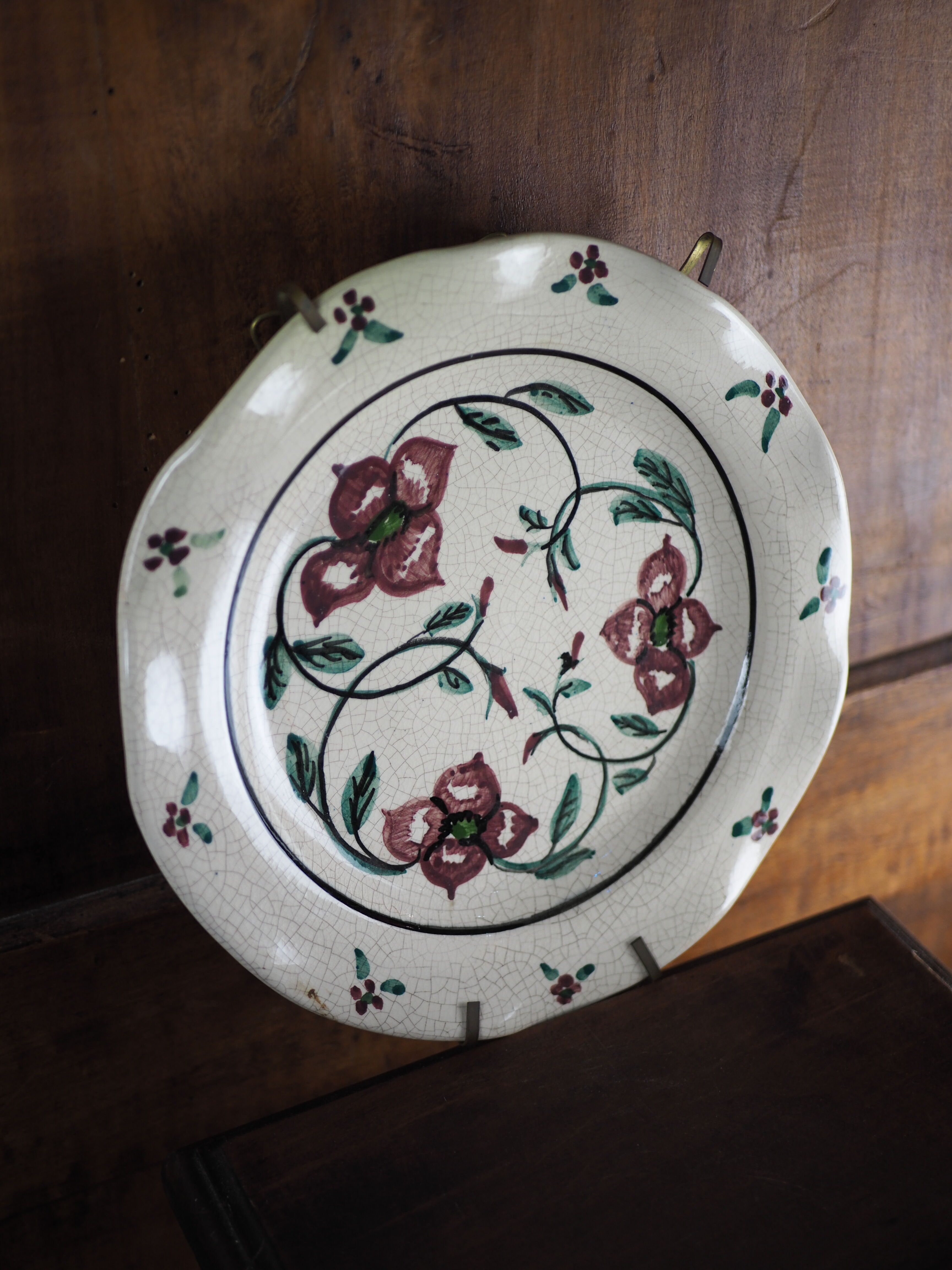 Meyssac plate decorated with flowers on cracked background early twentieth century and its support