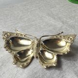 Butterfly-shaped brass pocket emptier
