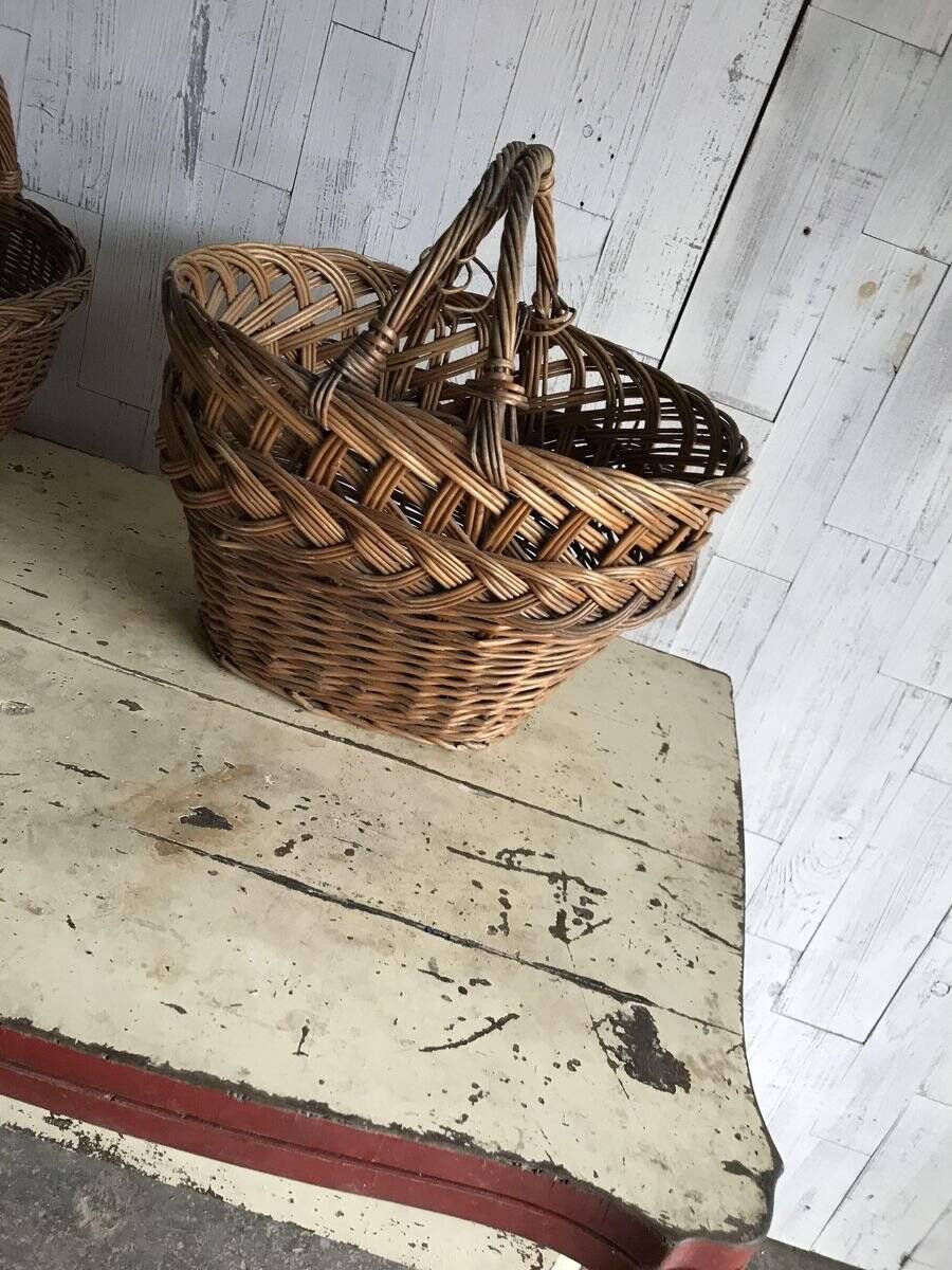 Set of 2 brown wicker baskets from the 1960s — decorative weaving and double handles.
