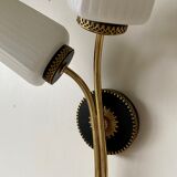 Black and gold metal wall and white opalines sconce