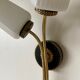 Black and gold metal wall and white opalines sconce