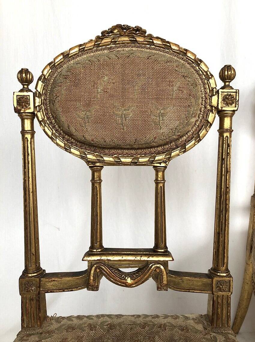 Series of three Louis XVI style chairs in gilded wood, circa 1900