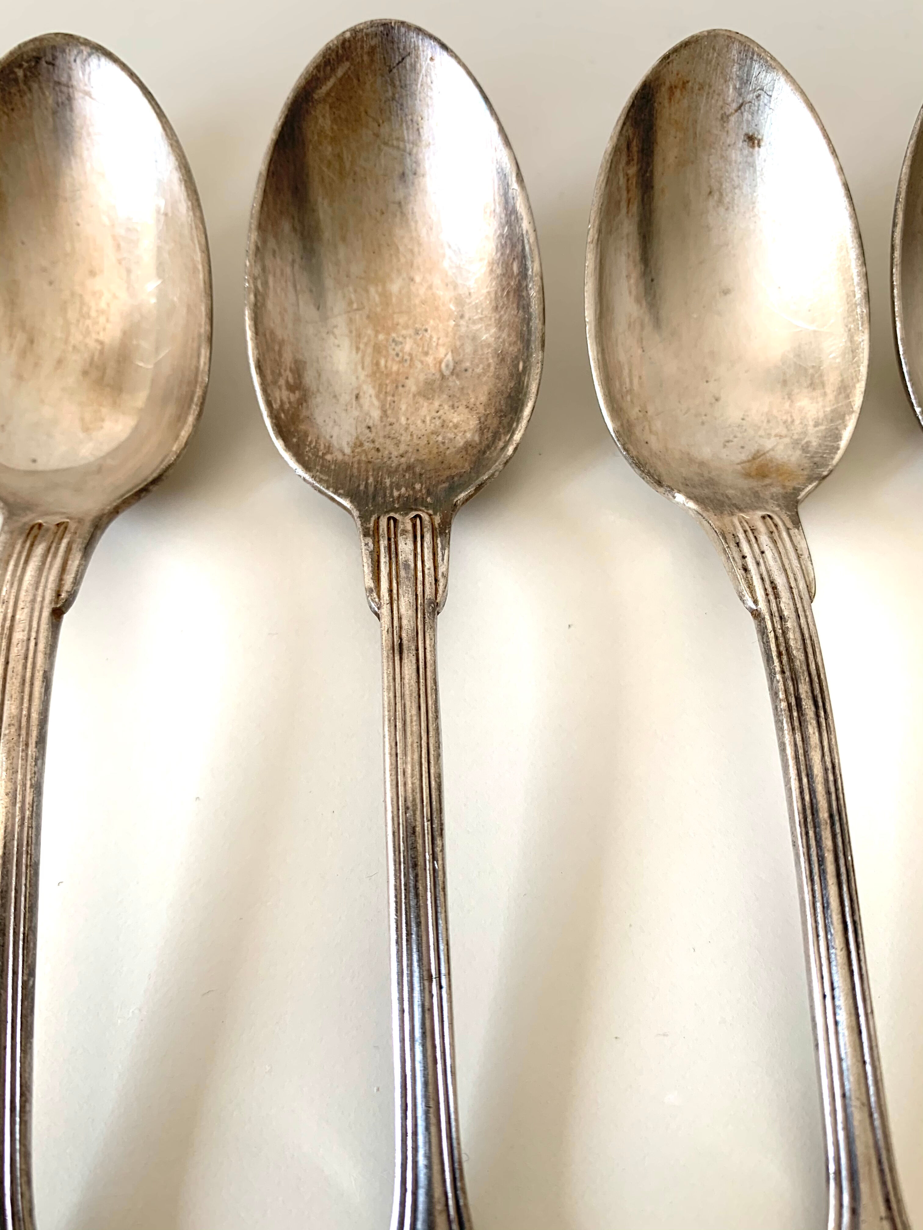 8 silver metal spoons
