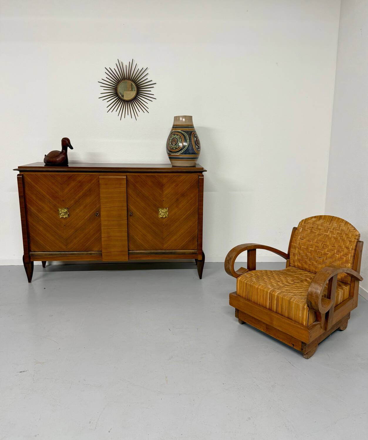 Antique art deco sideboard from the 1930s with veneered wood and bronze insert