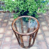 Round table in rattan and glass