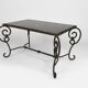 Coffee table in patinated wrought iron and black marble, circa 1940