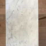 Pull-out tables in golden brass and marble