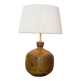 Square stone lamp with a cord shade.