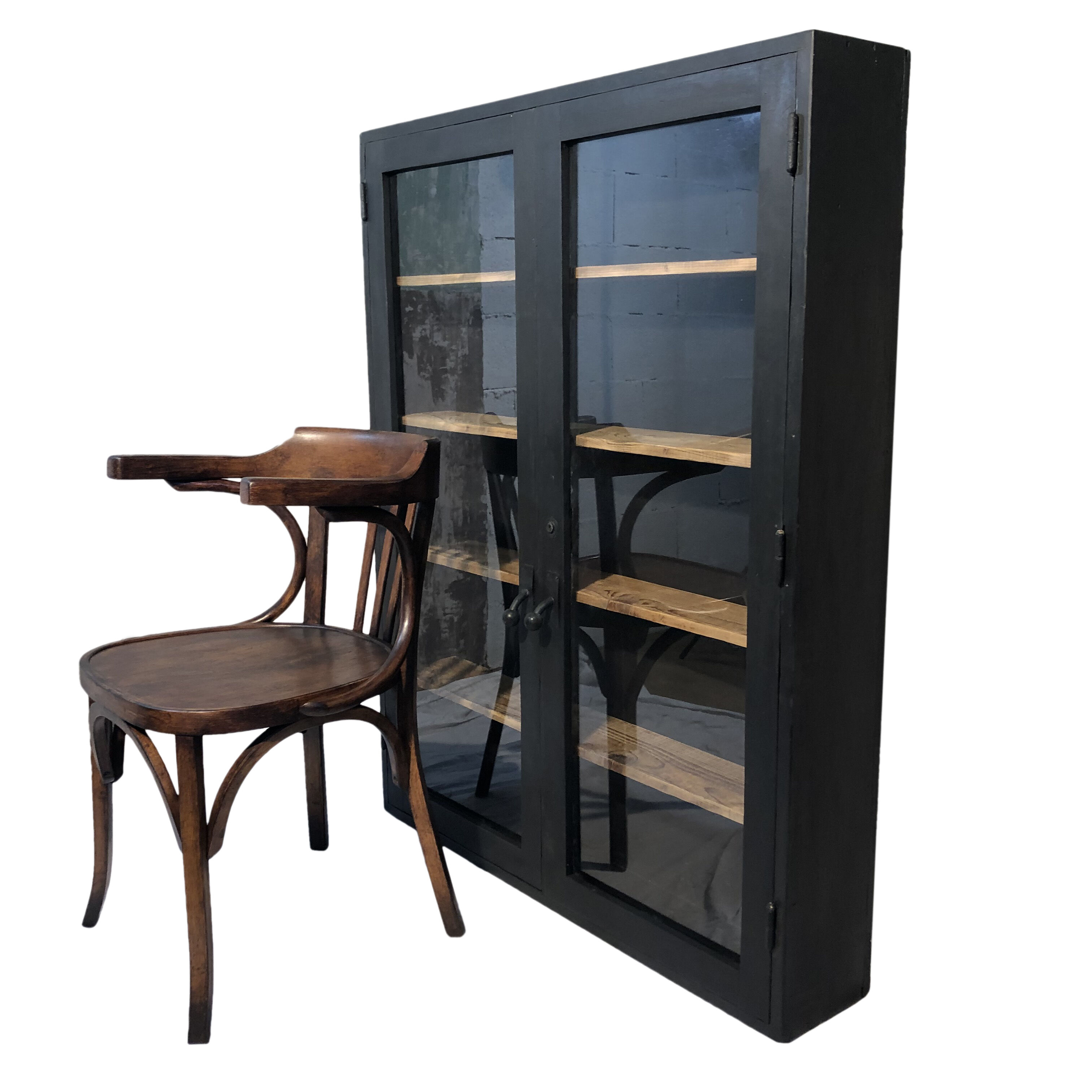 Former black painted wood workshop showcase