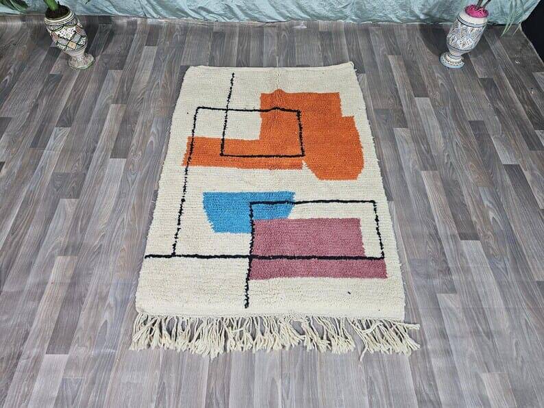 Traditional handmade wool Berber rug with colourful patterns.