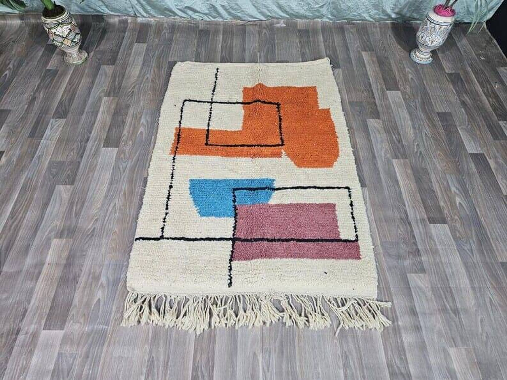 Traditional handmade wool Berber rug with colourful patterns.