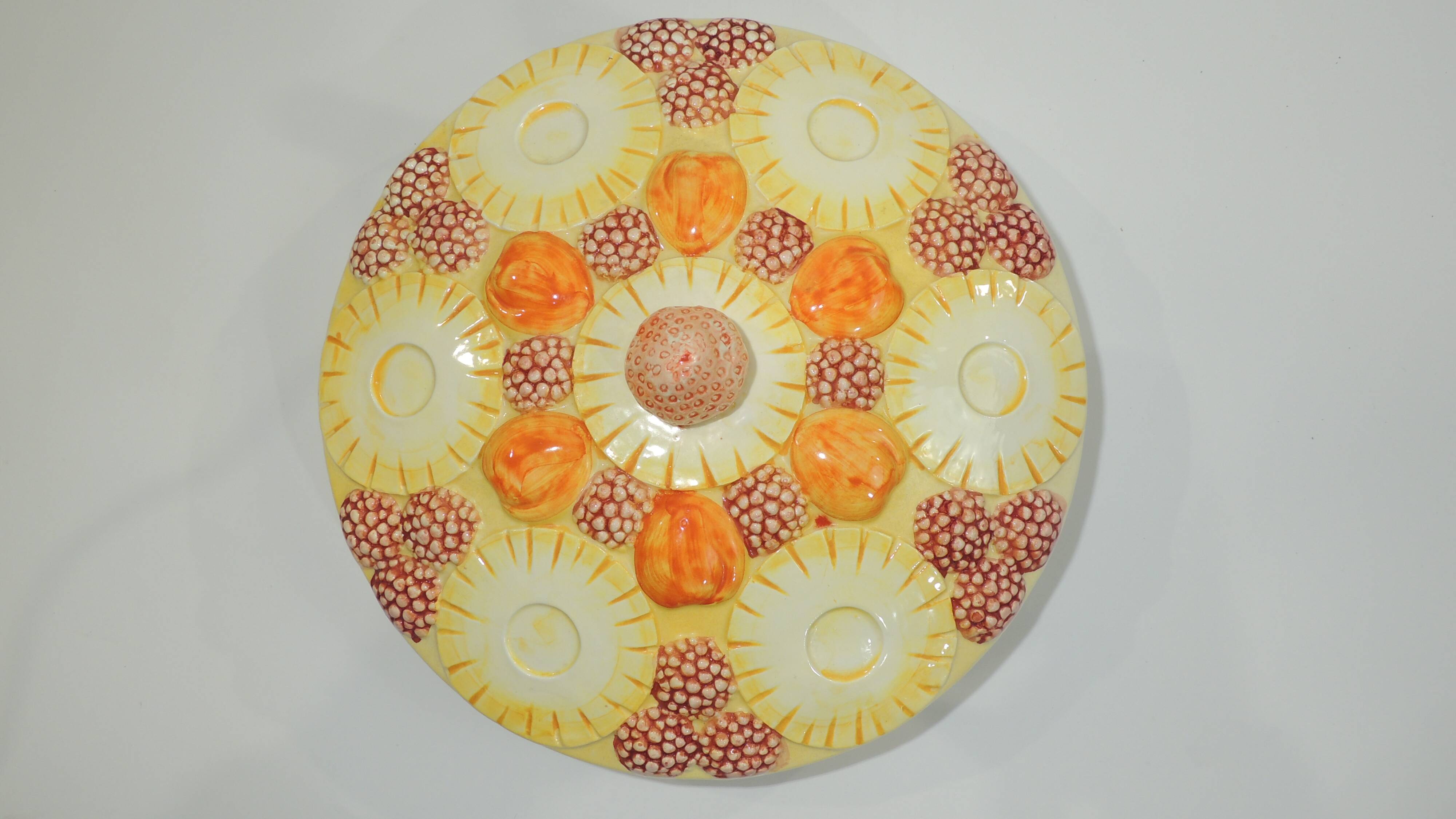 Magnificent fruit tart dish in slip signed "What's Vincent Cadeaux