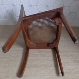 Chaise cannée art déco avec ornements en bronze.