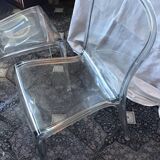 2 transparent plexiglass chairs