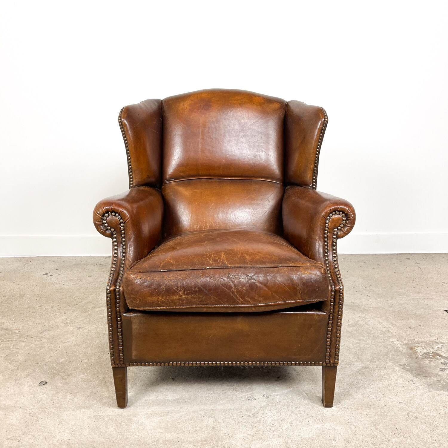 Dark brown sheep leather wingback armchair vintage
