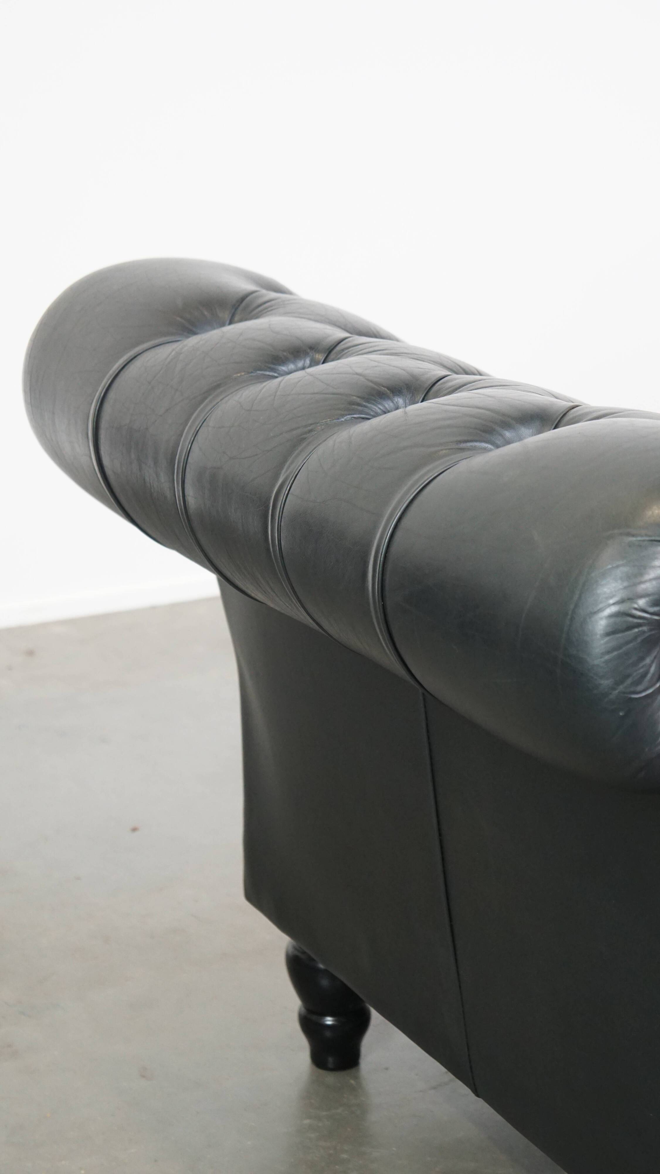 Black chesterfield daybed made of cowhide