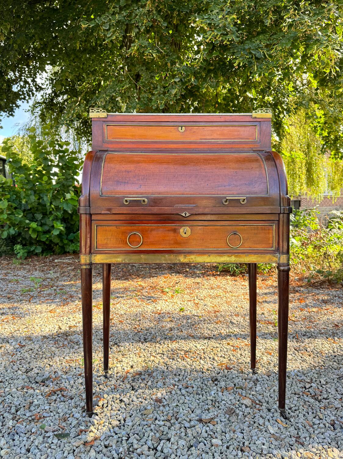 Elegant and rare Louis XVI period mahogany cylinder desk