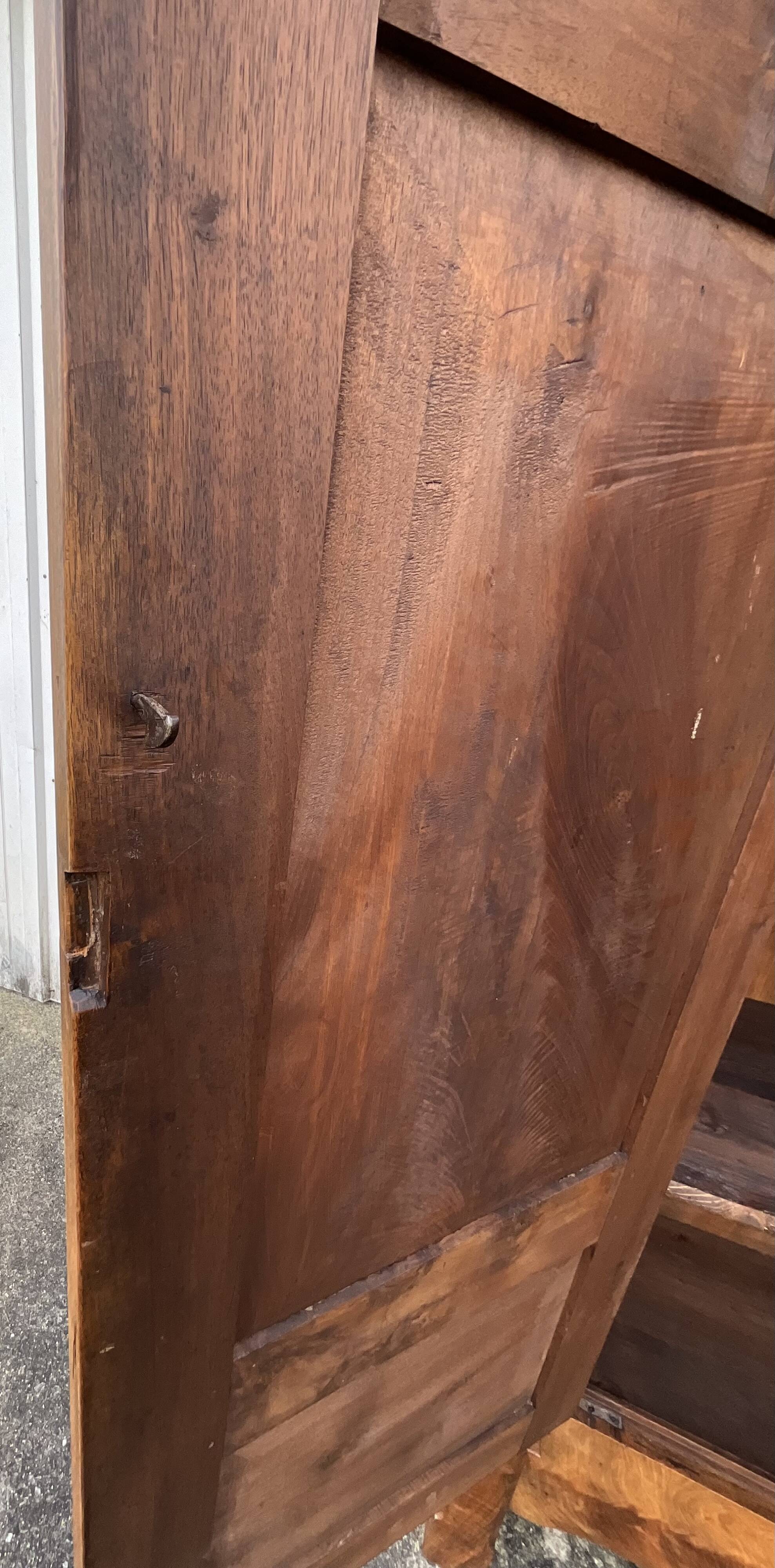 Empire wardrobe in solid walnut, France, mid-19th century.