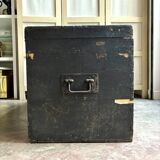 Trunk, black wooden chest and wallpaper