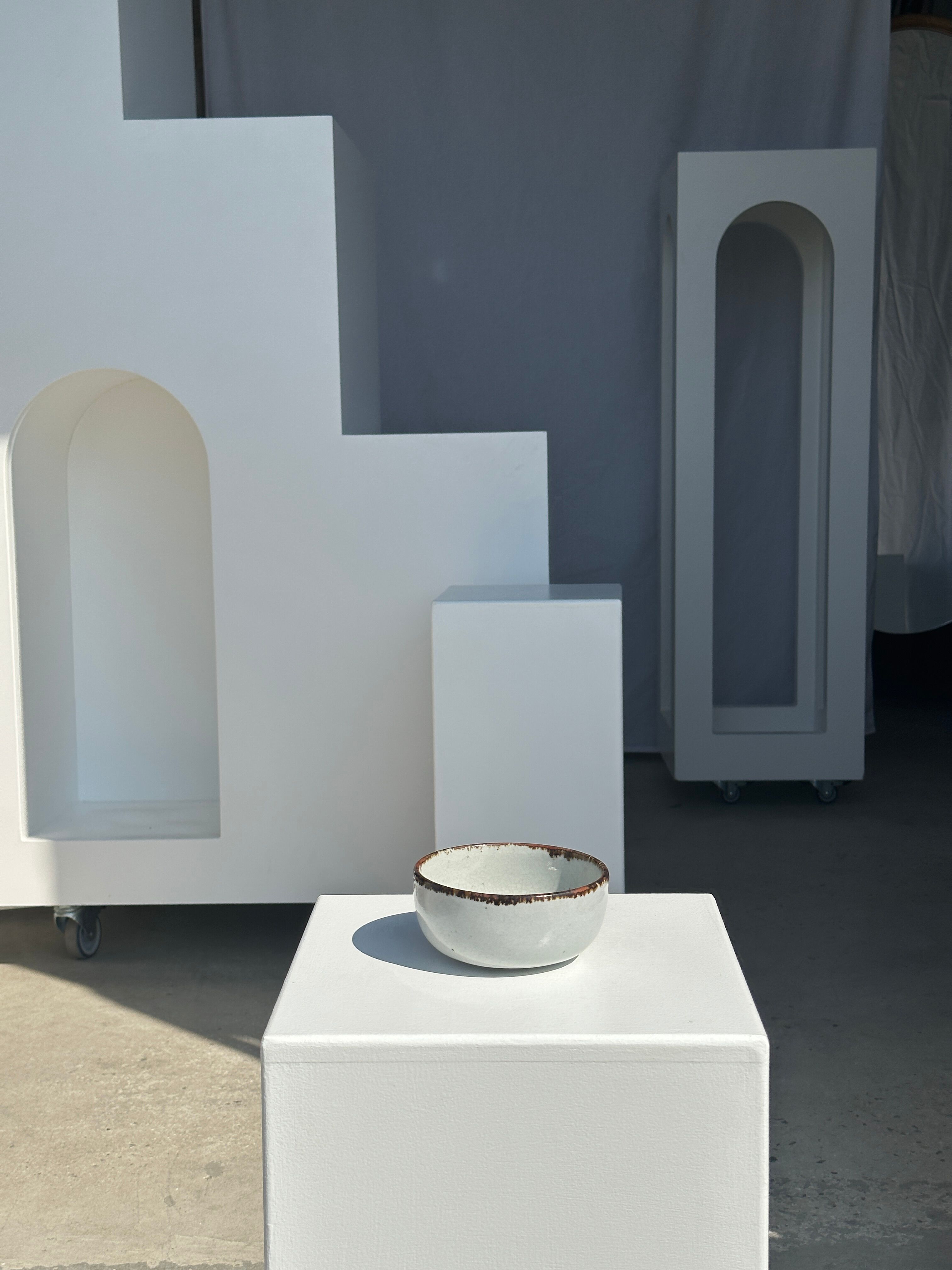 Small white glazed ceramic bowl black edges