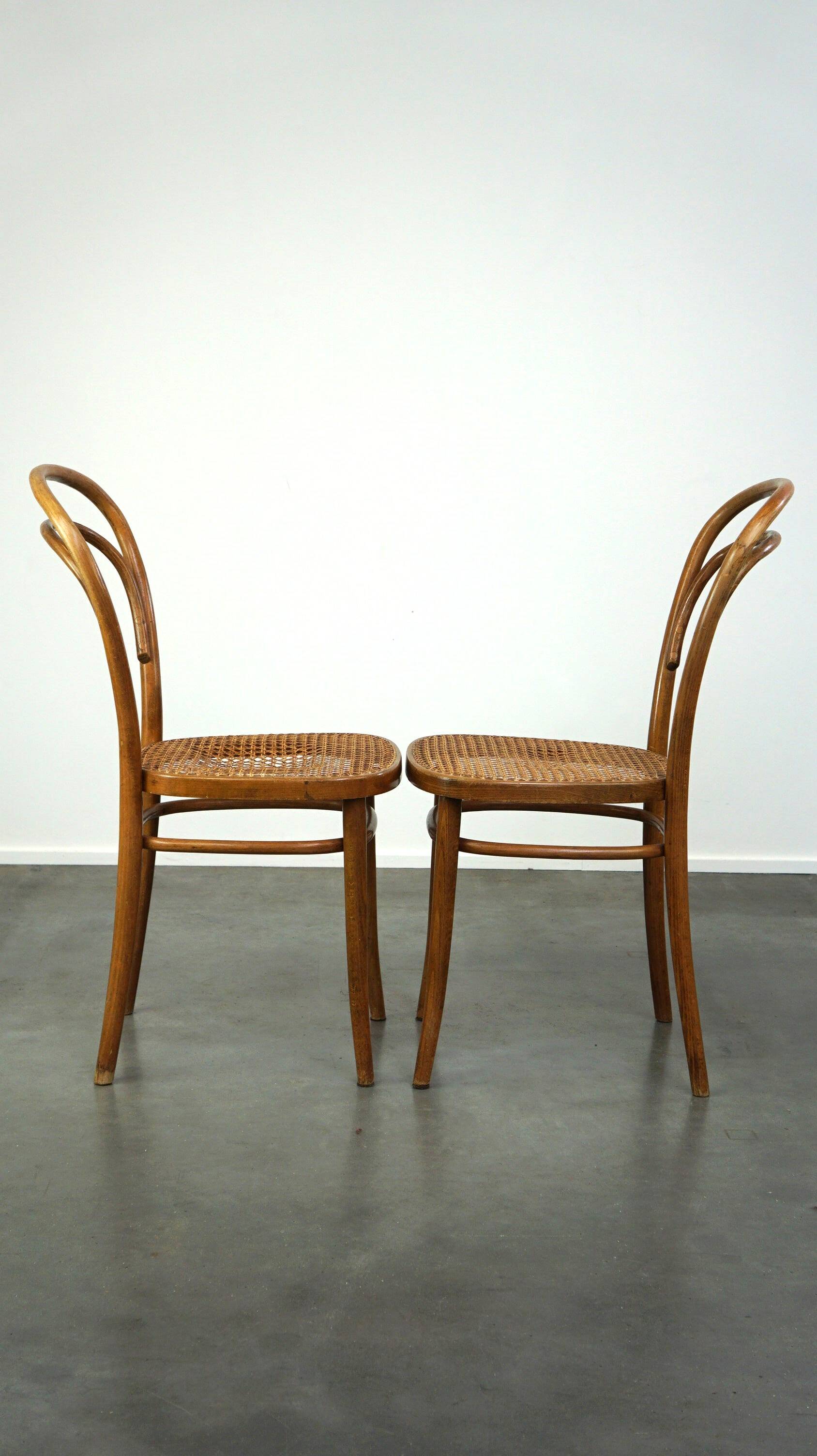 Lovely set of 2 brown vintage bistro chairs with woven seats