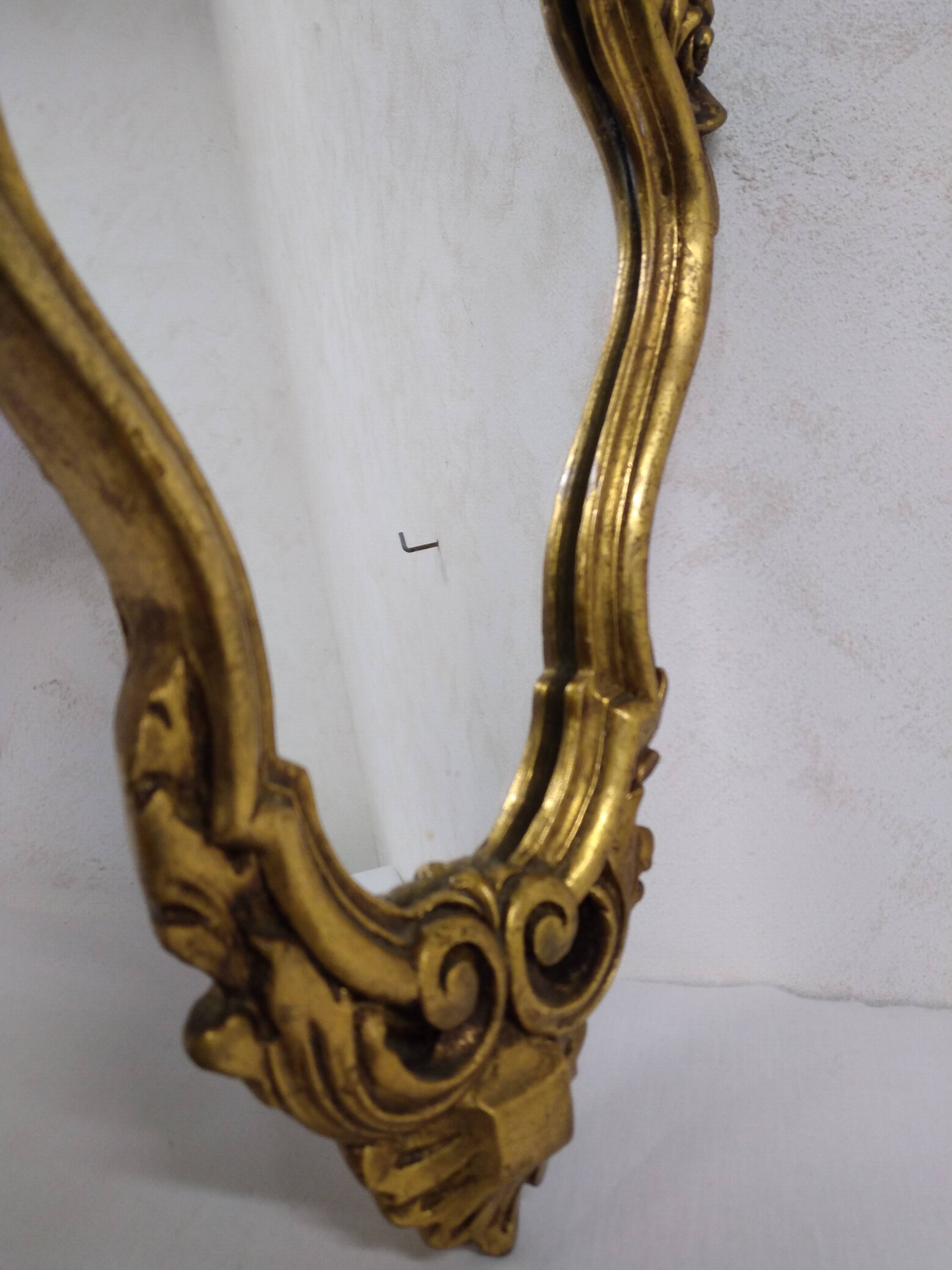 Gold stucco rocaille style mirror