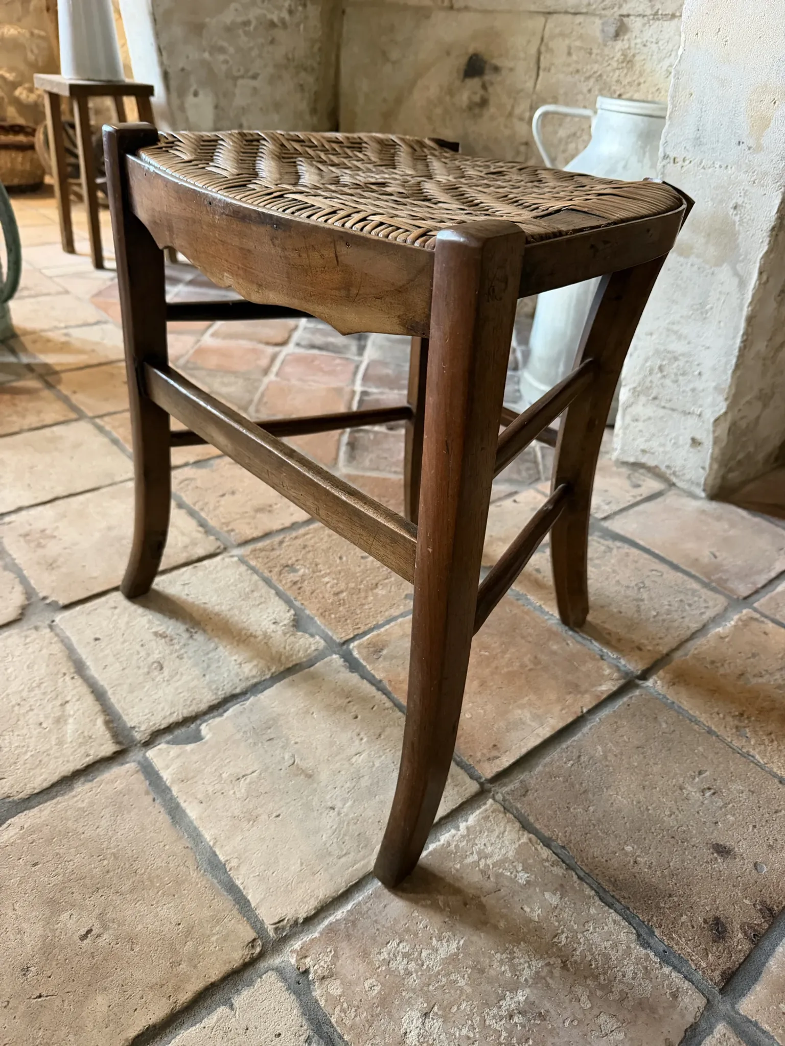 Campaign stool in rattan and wood