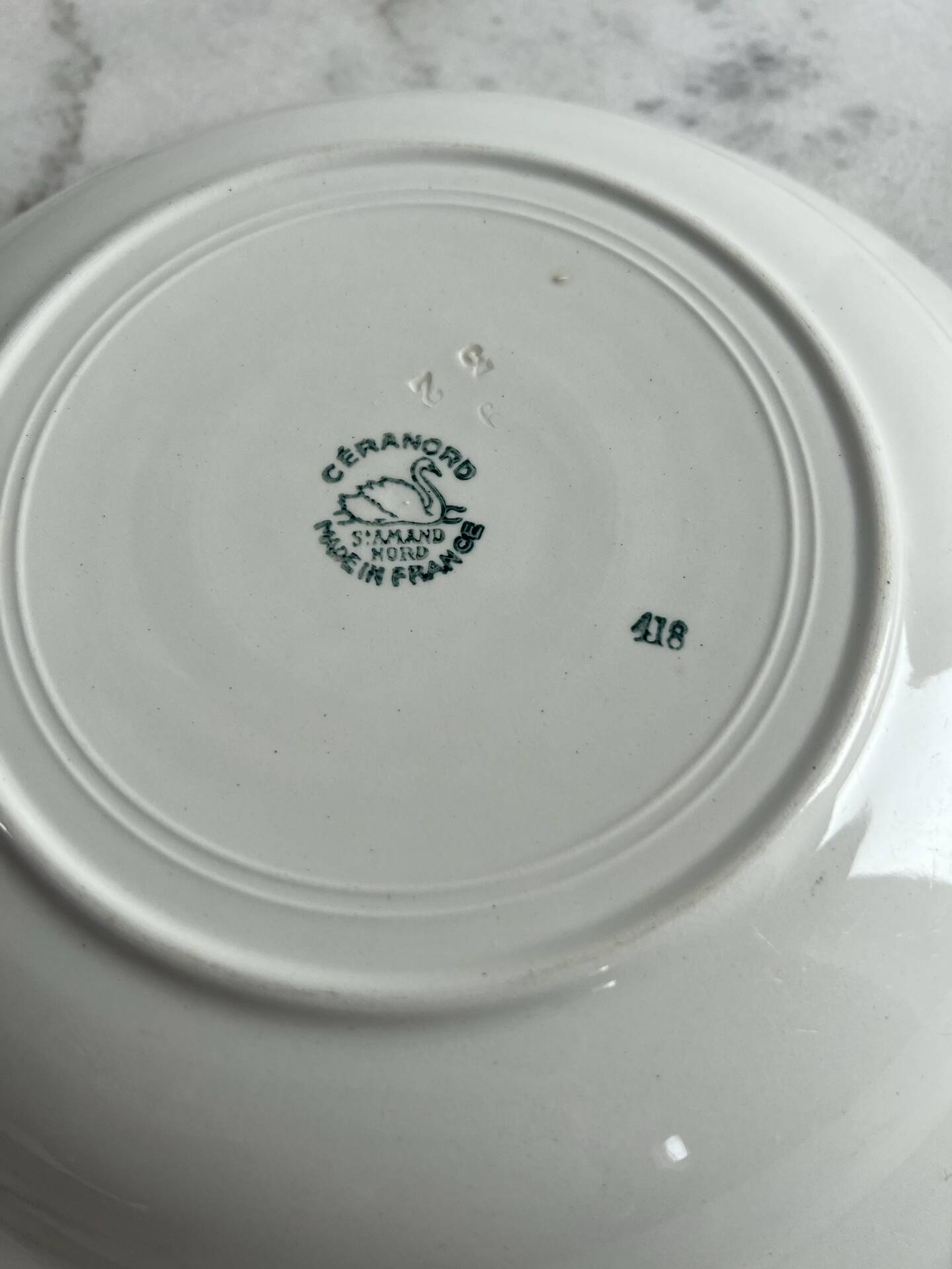 Longwy salad bowl with blue and orange floral decoration.