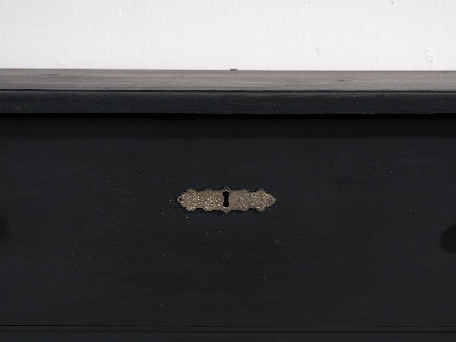 Antique chest of drawers in dark tones (c.1920)