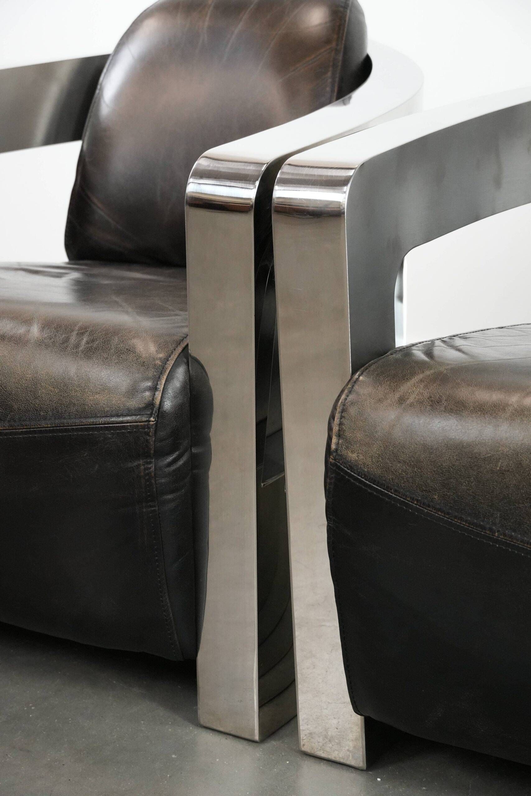 Set of two cowhide leather Aviator design armchairs with aluminium