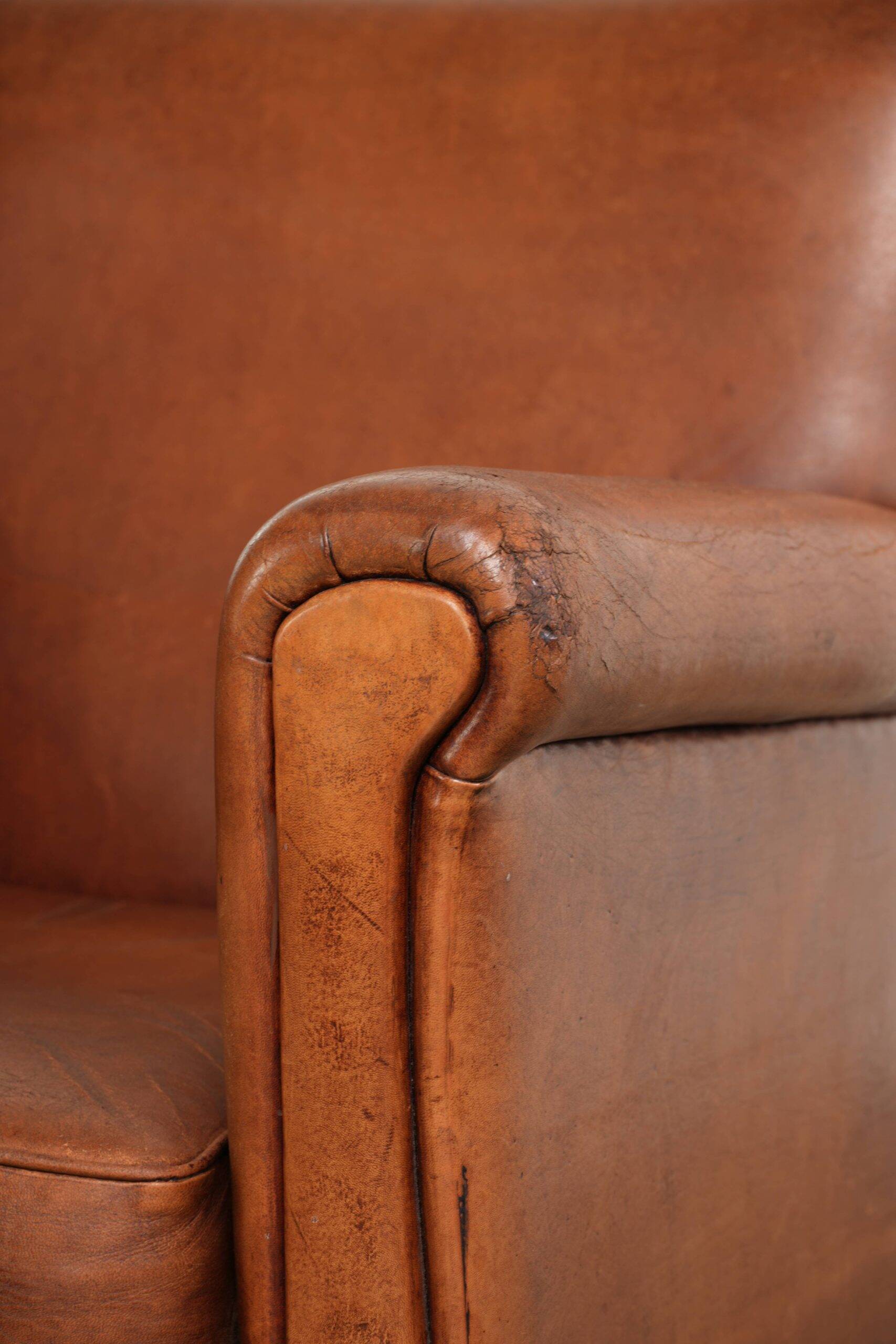 Sturdy vintage sheepskin armchair with a beautiful cognac colour