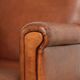 Sturdy vintage sheepskin armchair with a beautiful cognac colour