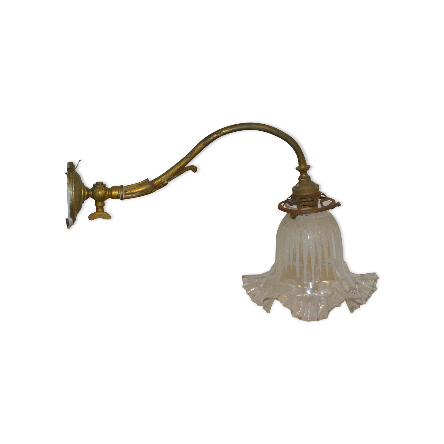 Brass wall sconce with a glass tulip
