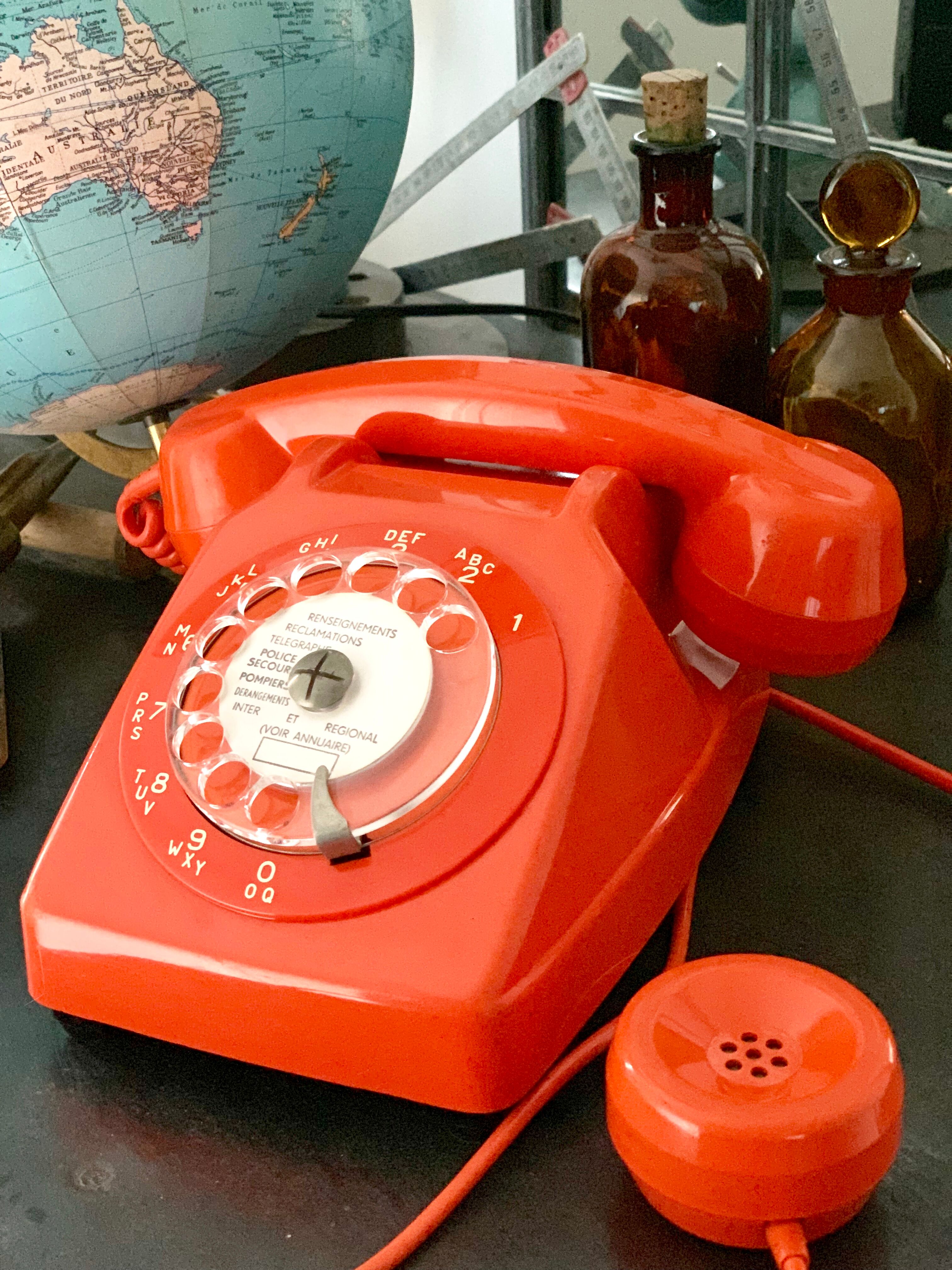 Old orange vintage dial phone