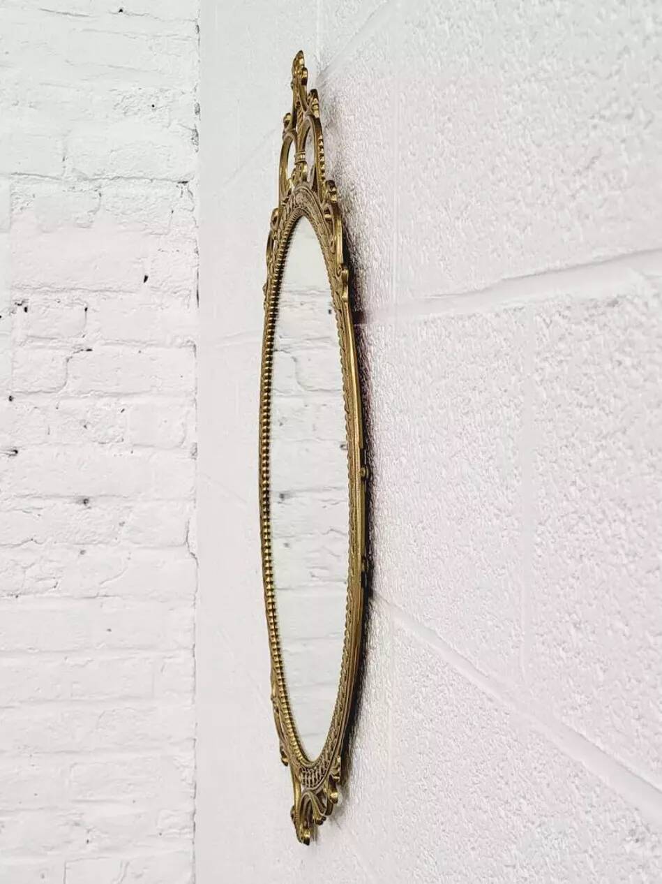 Italian oval brass medallion mirror