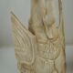 Deux ornements d'applique en bois sculpté et laqué crème,  représentant des cygnes