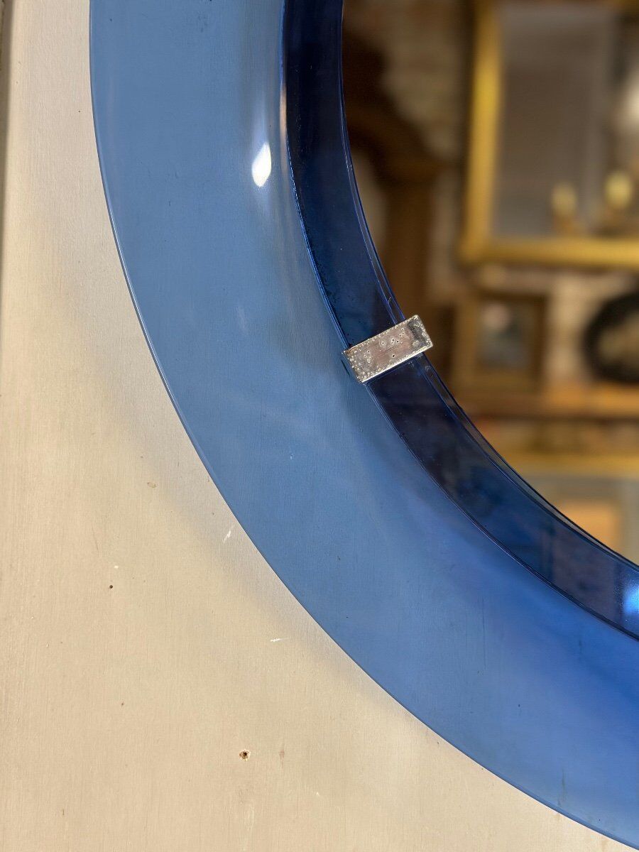 Mirror framed by a blue glass circle, italy circa 1950